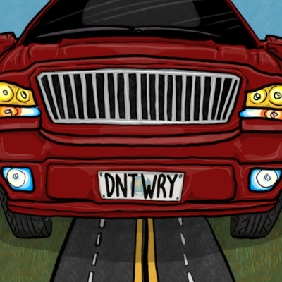 A large red SUV, with the license plate DNTWRY. It's way too close, and so big that the sides and top are out of frame. Its footprint is even too big to fit on the road under it, and it's probably going way too fast towards you -- watch out!